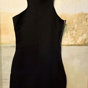 Stylish black cocktail dress with a metal lock